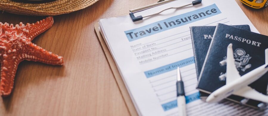 HealthGuys licensed agent helping Dallas-Fort Worth traveler compare travel insurance plans for international trip
