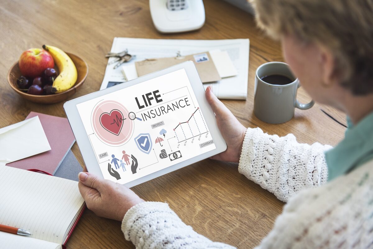 DFW self-employed professional reviewing life insurance retirement planning options with HealthGuys licensed agent