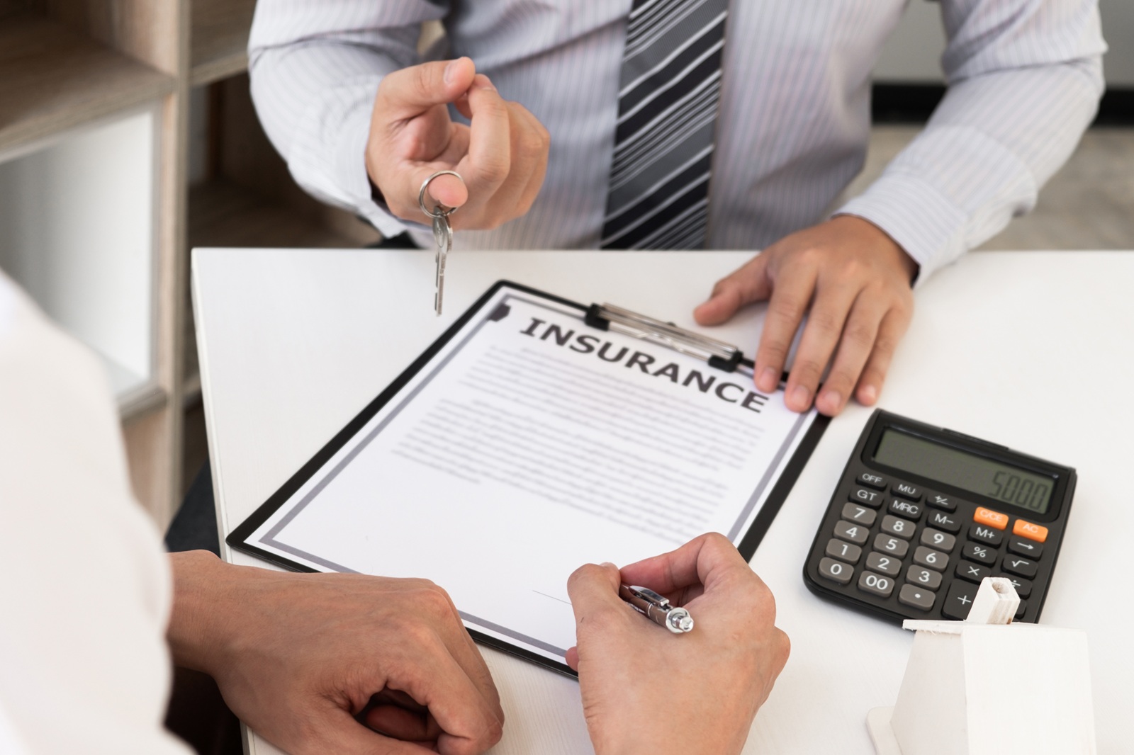 Dallas-Fort Worth policyholder reviewing life insurance cash value statement with a HealthGuys agent