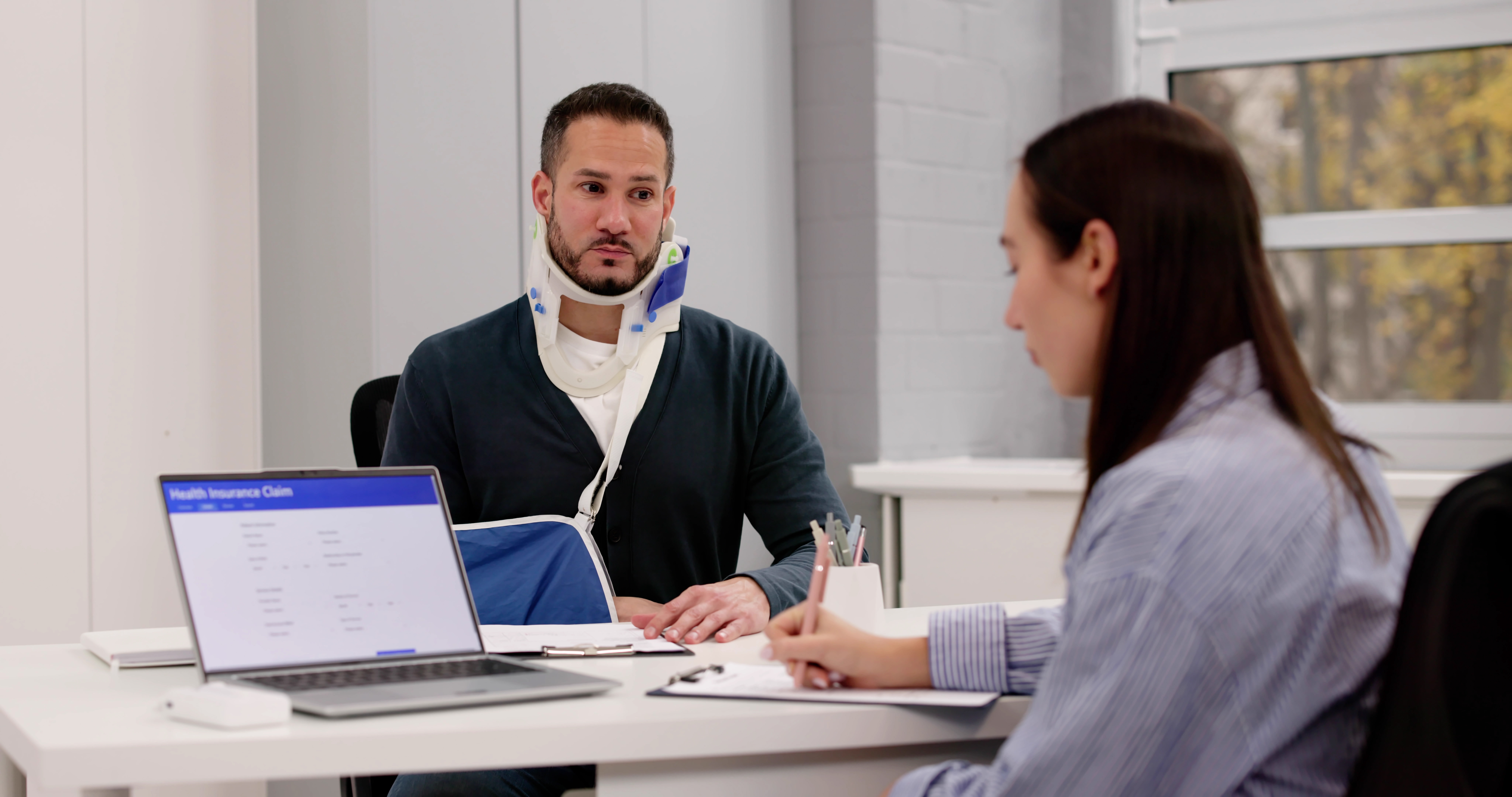 Dallas self-employed professional reviewing health and liability insurance coverage options