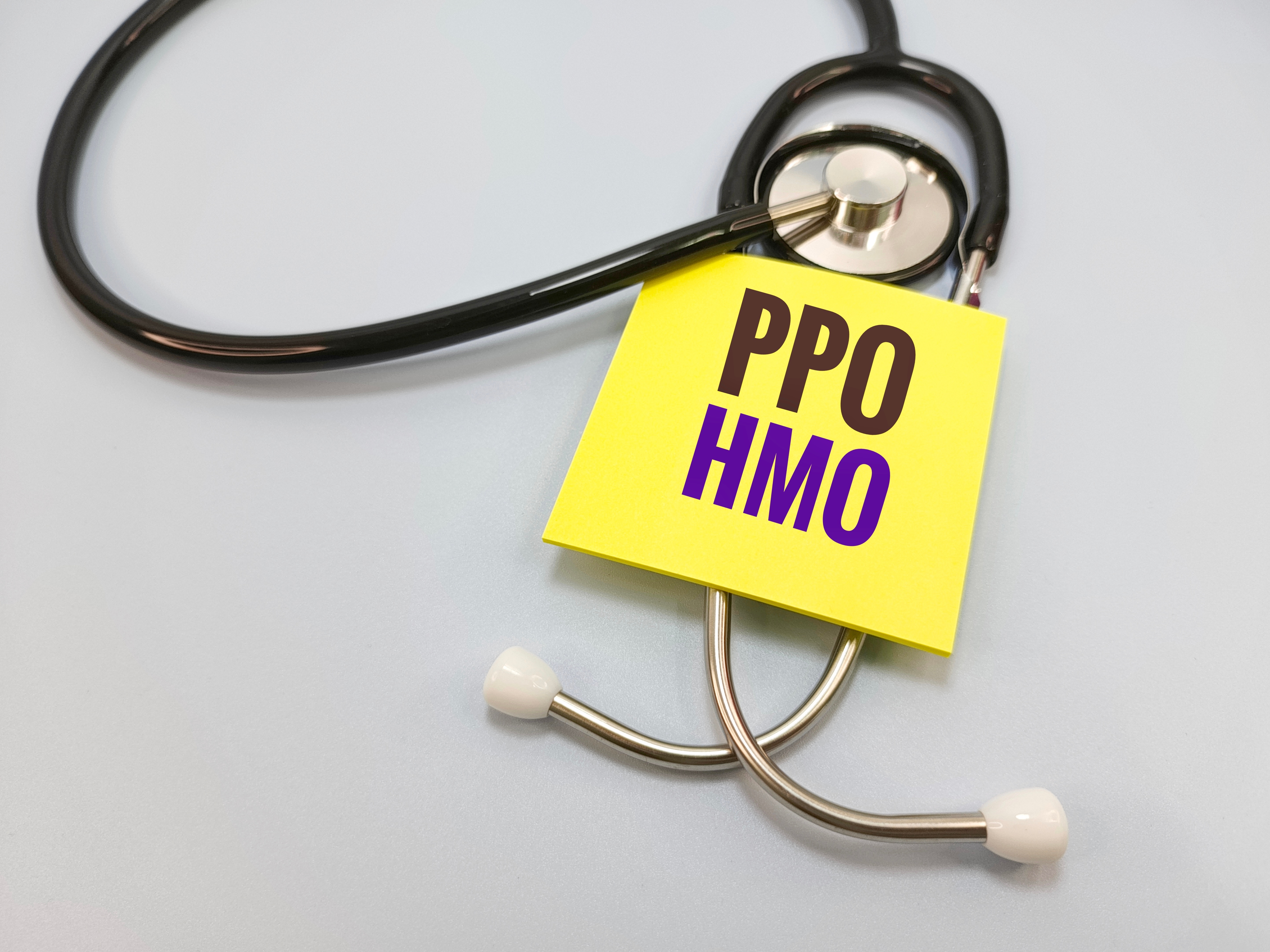Dallas-Fort Worth family comparing PPO and HMO health plan networks with a HealthGuys licensed agent