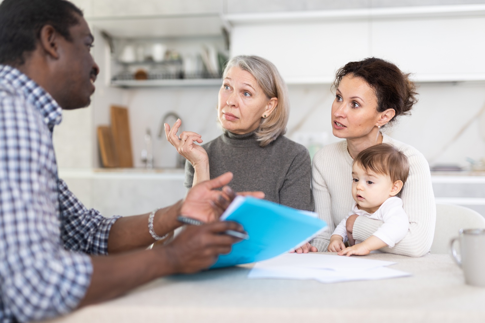 Dallas-Fort Worth family reviewing a life insurance policy document with a HealthGuys agent to understand exclusions